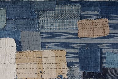 Indigo–dyed boro fabric